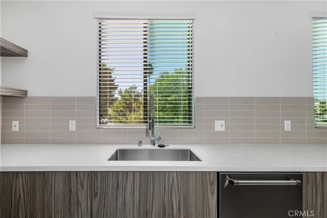 a bathroom with a shower a sink a toilet and mirror