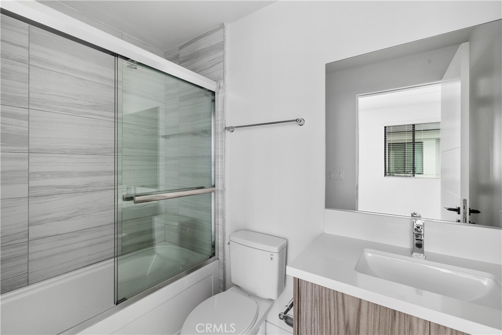 6719 Sepulveda Boulevard Van Nuys, CA 91406 - Photo 24 of 60 a bathroom with a sink and a mirror