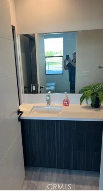 6719 Sepulveda Boulevard Van Nuys, CA 91406 - Photo 26 of 60 a bathroom with a sink and a mirror