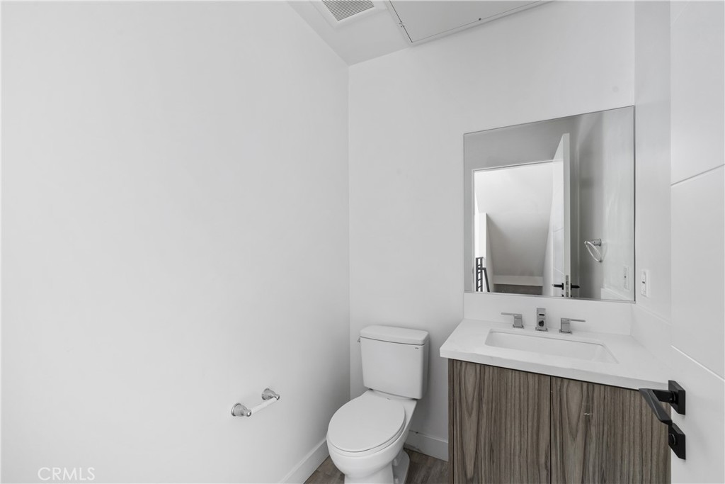 6719 Sepulveda Boulevard Van Nuys, CA 91406 - Photo 28 of 60 a bathroom with a sink and a toilet