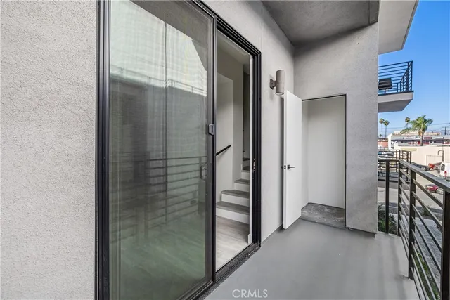 an empty room with wooden floor and closet