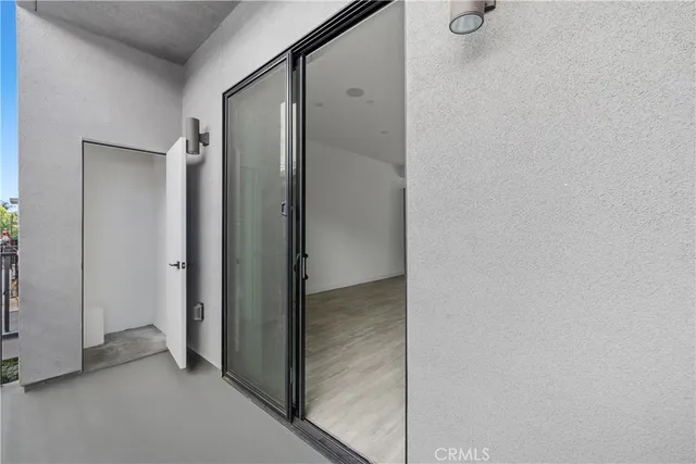 a view of staircase with white walls and a window