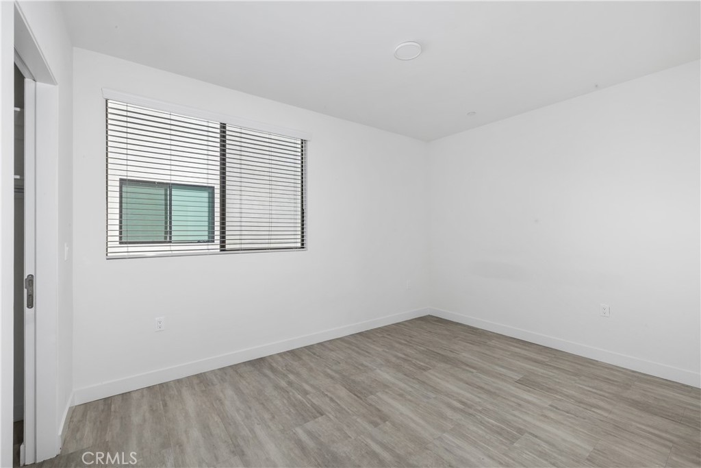 6719 Sepulveda Boulevard Van Nuys, CA 91406 - Photo 38 of 60 wooden floor in an empty room with a window