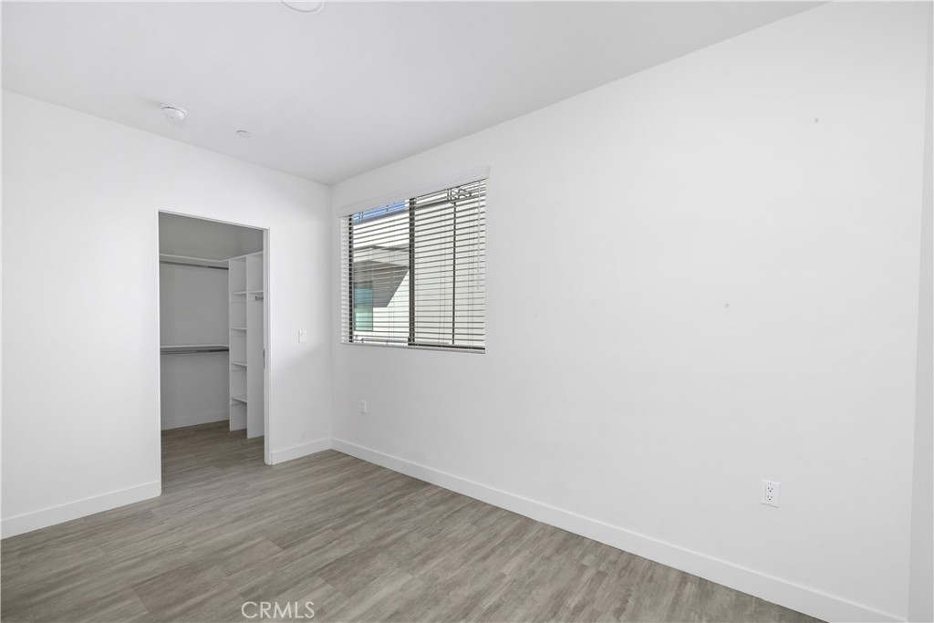 6719 Sepulveda Boulevard Van Nuys, CA 91406 - Photo 40 of 60 an empty room with wooden floor and closet