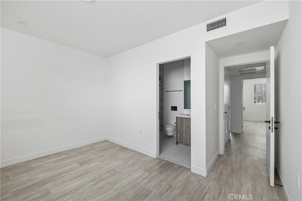 6719 Sepulveda Boulevard Van Nuys, CA 91406 - Photo 45 of 60 wooden floor & closet in a room
