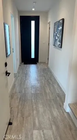 a view of entryway with wooden floor