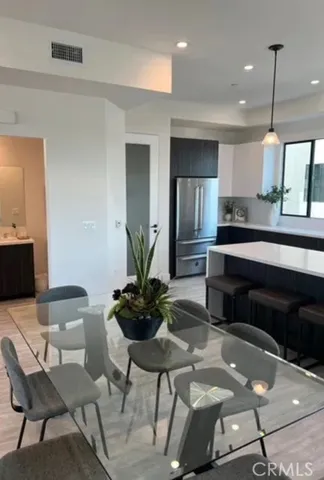 a living room with furniture and large windows