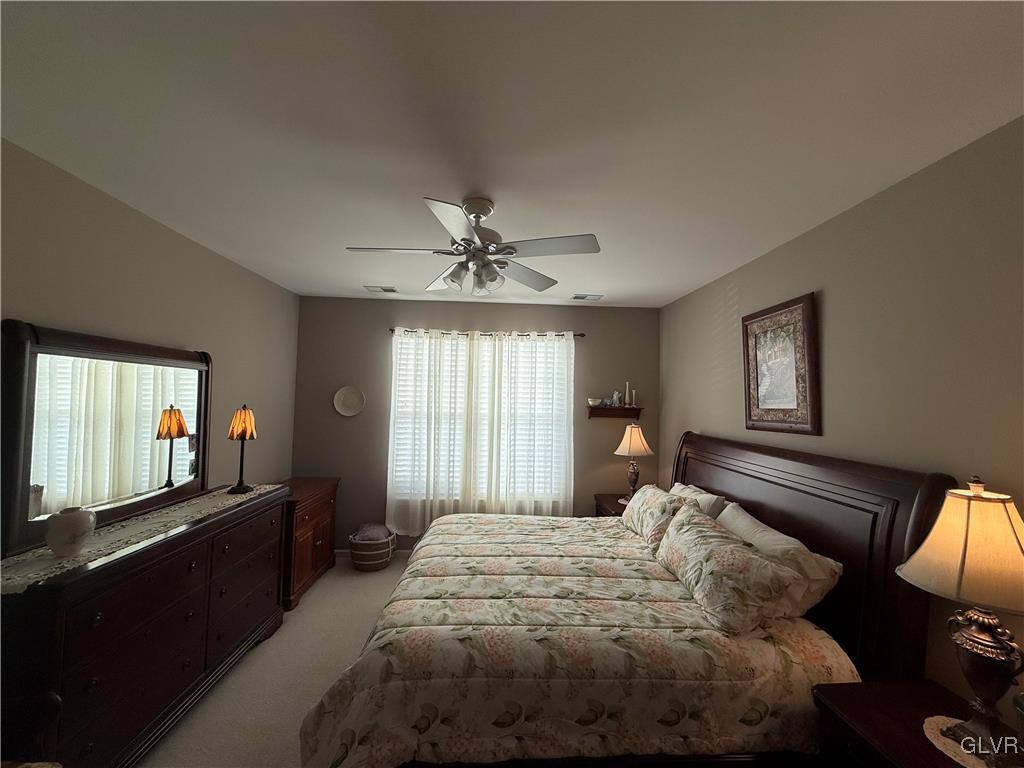1847 Gregory Place Hellertown, PA 18055 - Photo 14 of 27 a bedroom with a bed and a chandelier