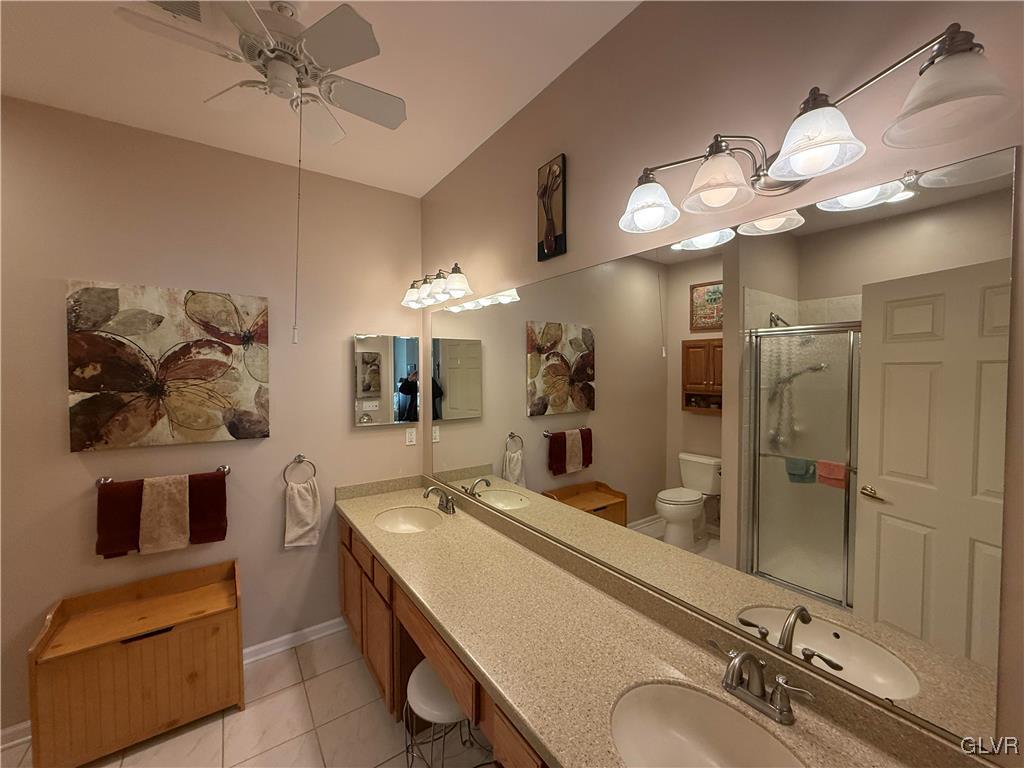 1847 Gregory Place Hellertown, PA 18055 - Photo 15 of 27 a bathroom with a sink a large mirror and shower