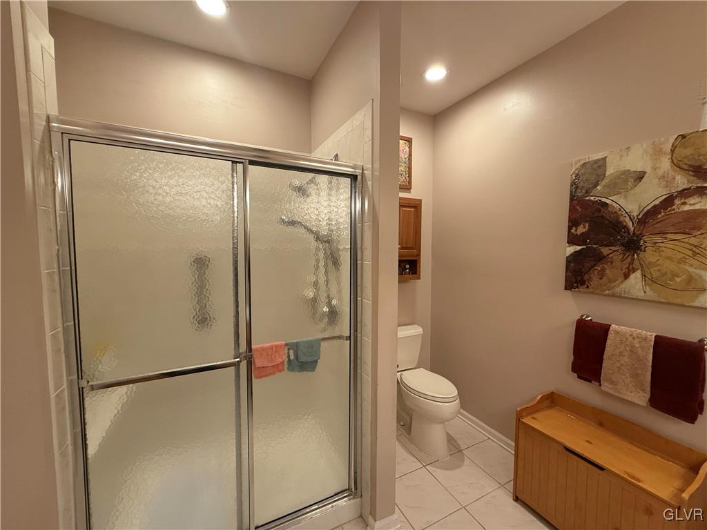 1847 Gregory Place Hellertown, PA 18055 - Photo 16 of 27 a bathroom with a glass shower door