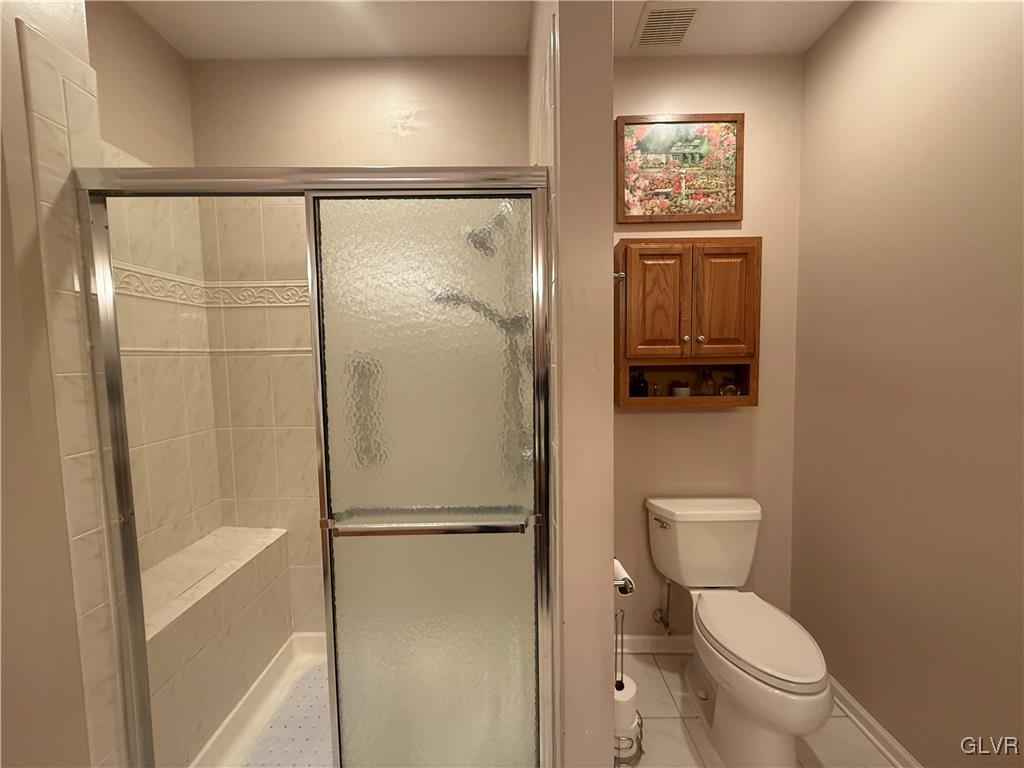 1847 Gregory Place Hellertown, PA 18055 - Photo 17 of 27 a white toilet sitting next to a bathroom sink