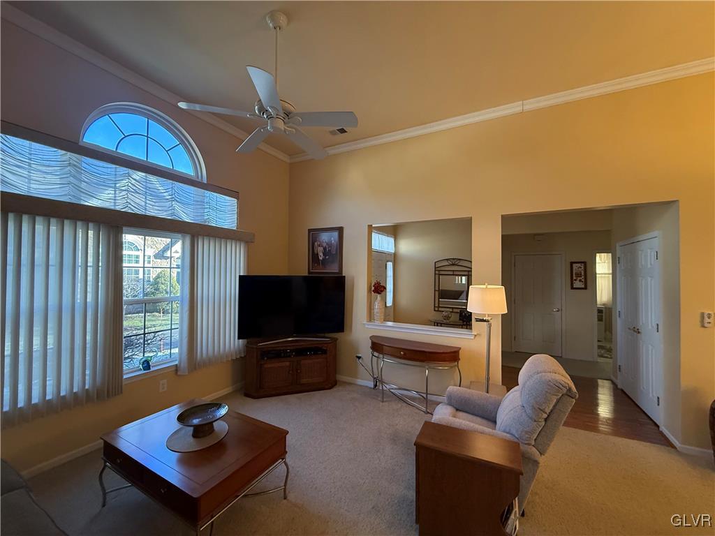 1847 Gregory Place Hellertown, PA 18055 - Photo 6 of 27 a living room with furniture a flat screen tv and a window