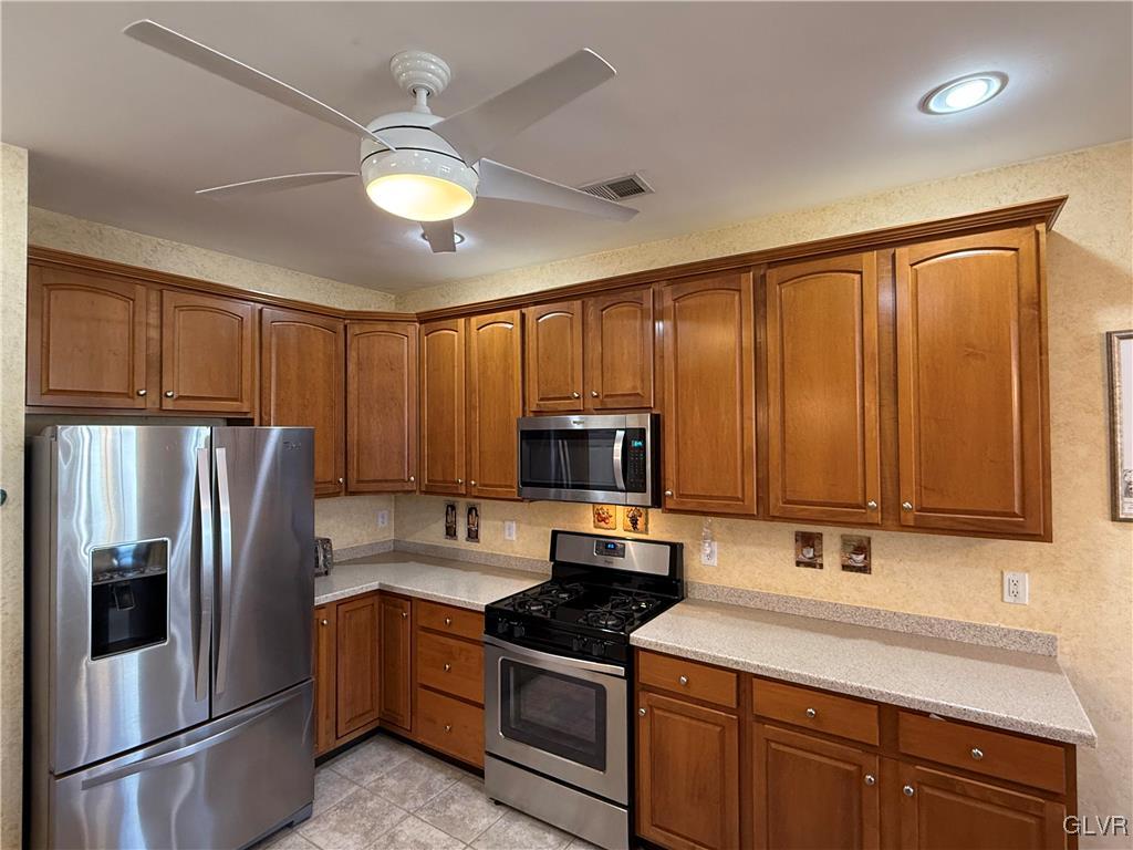 1847 Gregory Place Hellertown, PA 18055 - Photo 10 of 27 a kitchen with stainless steel appliances granite countertop a refrigerator stove and sink