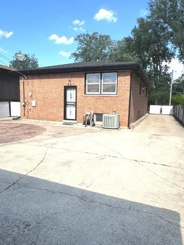 a view of a house with snow on the road