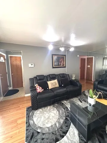 a living room with furniture and a breakfast area