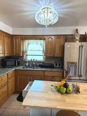 a kitchen with a sink cabinets and window
