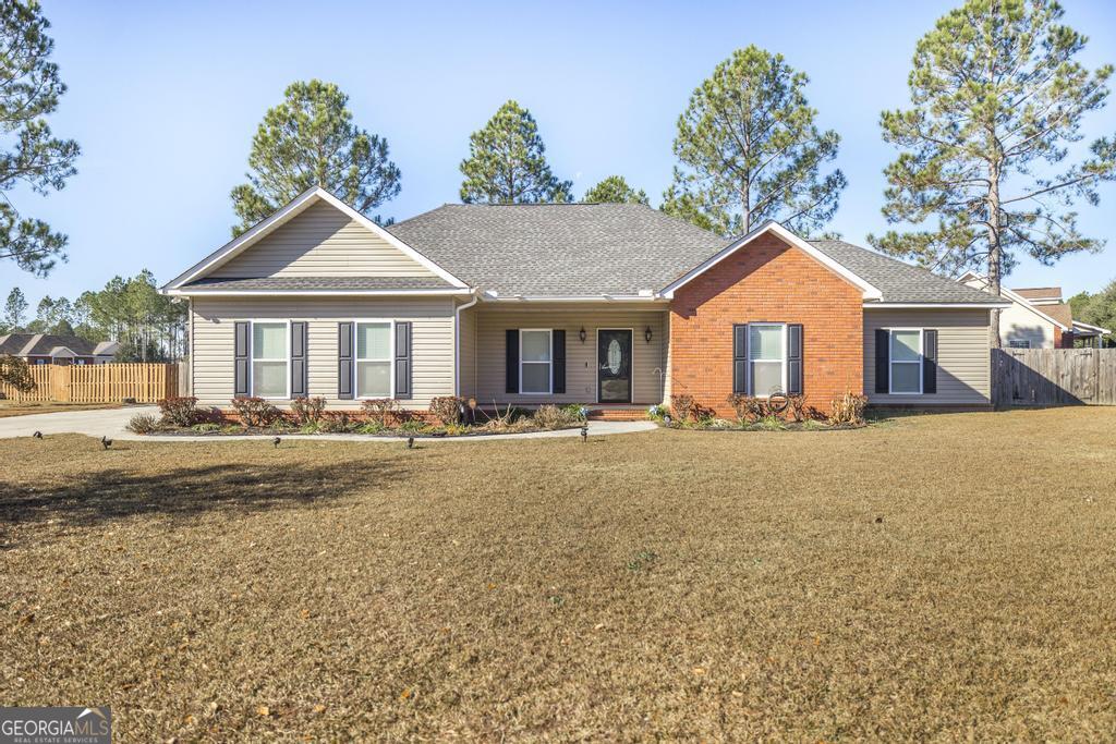 a front view of a house with a yard