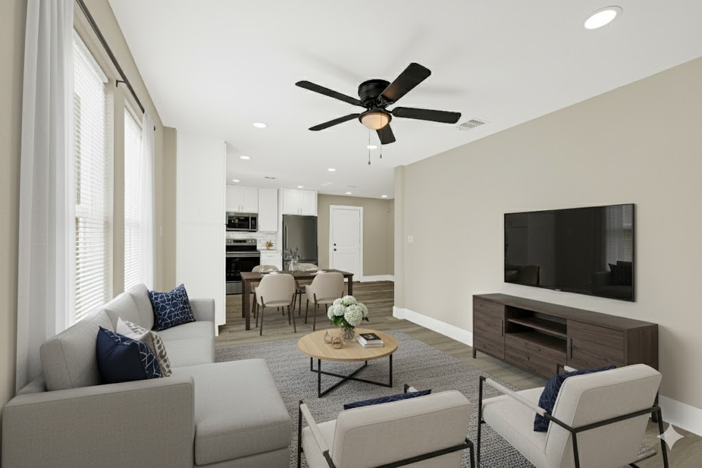3510 Nagle Street Houston, TX 77004 - Photo 6 of 26 a living room with furniture and a flat screen tv
