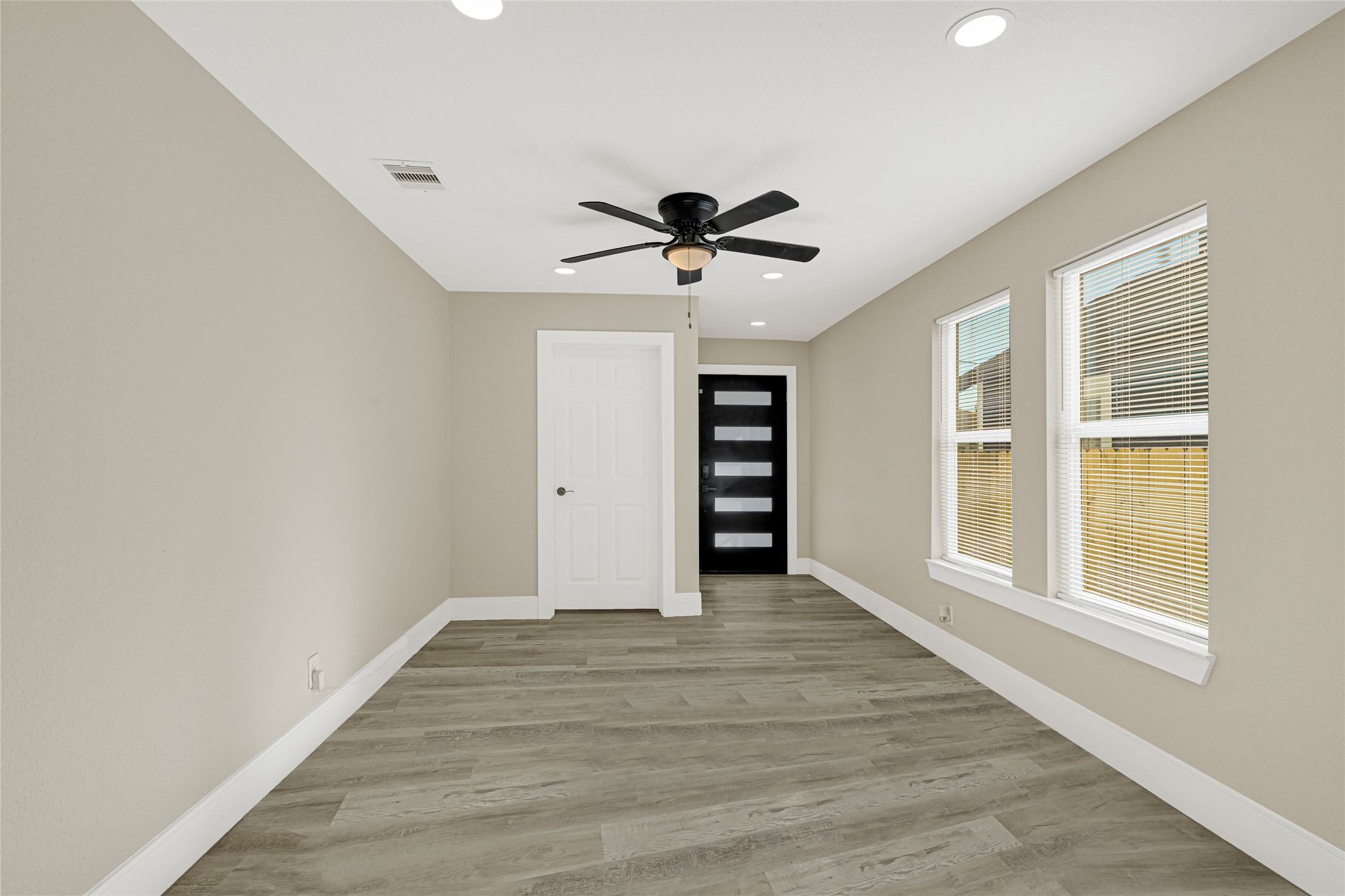 3510 Nagle Street Houston, TX 77004 - Photo 7 of 26 wooden floor in an empty room with a window