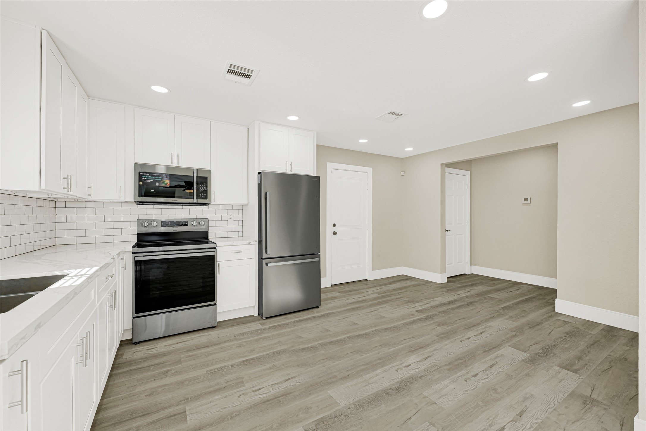 3510 Nagle Street Houston, TX 77004 - Photo 8 of 26 a kitchen with a refrigerator and a sink