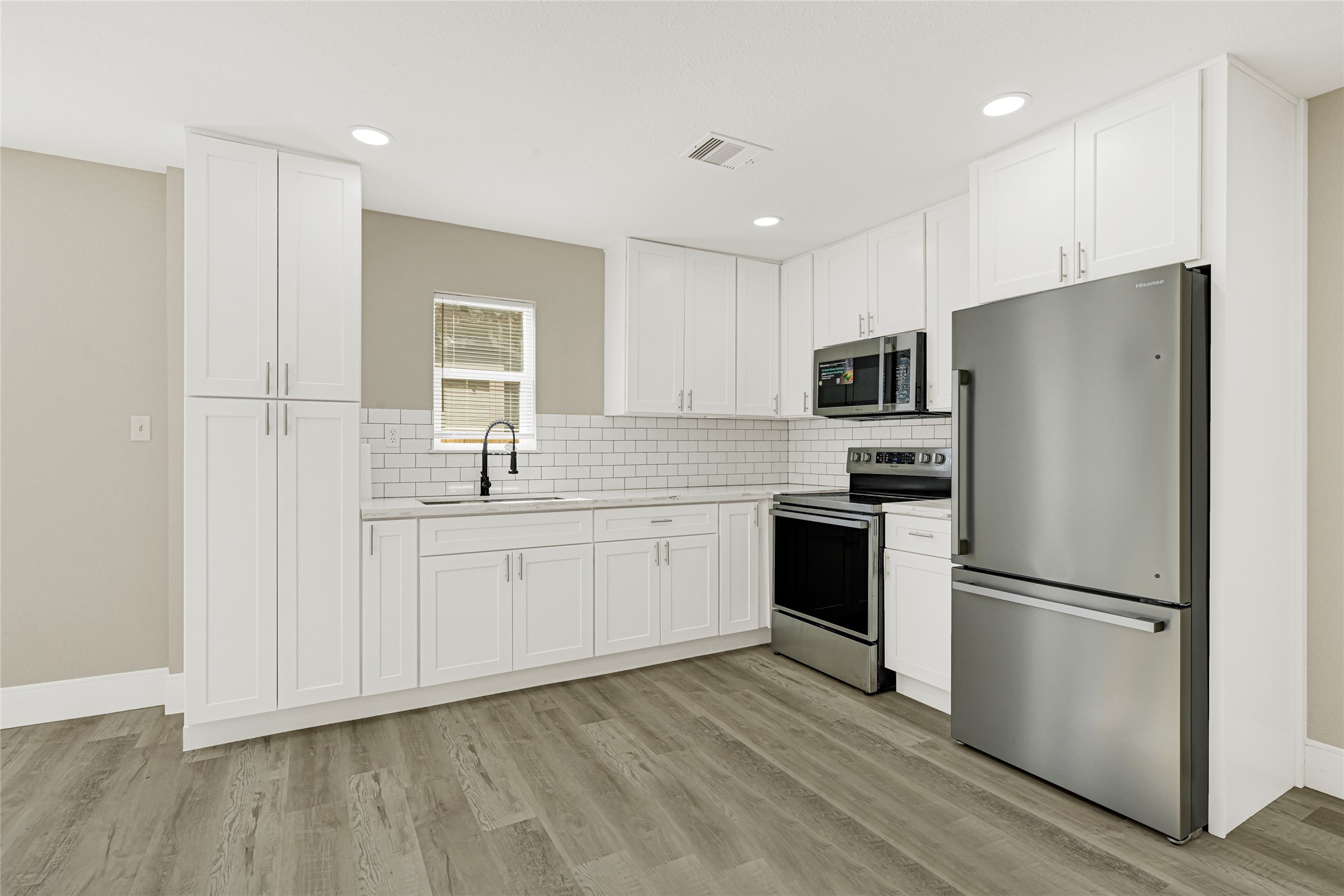 3510 Nagle Street Houston, TX 77004 - Photo 9 of 26 a kitchen with a refrigerator a sink and dishwasher