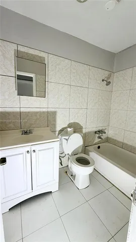 a bathroom with a bathtub and a sink