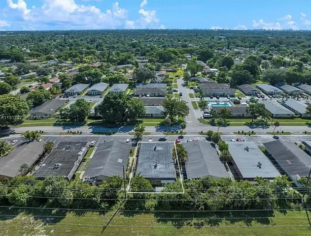 an aerial view of a house with a garden