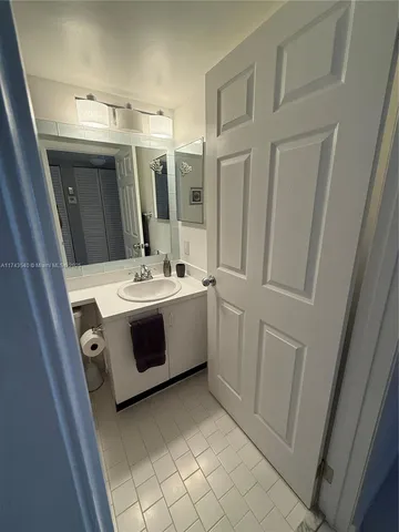 a view of a dining room furniture and chandelier