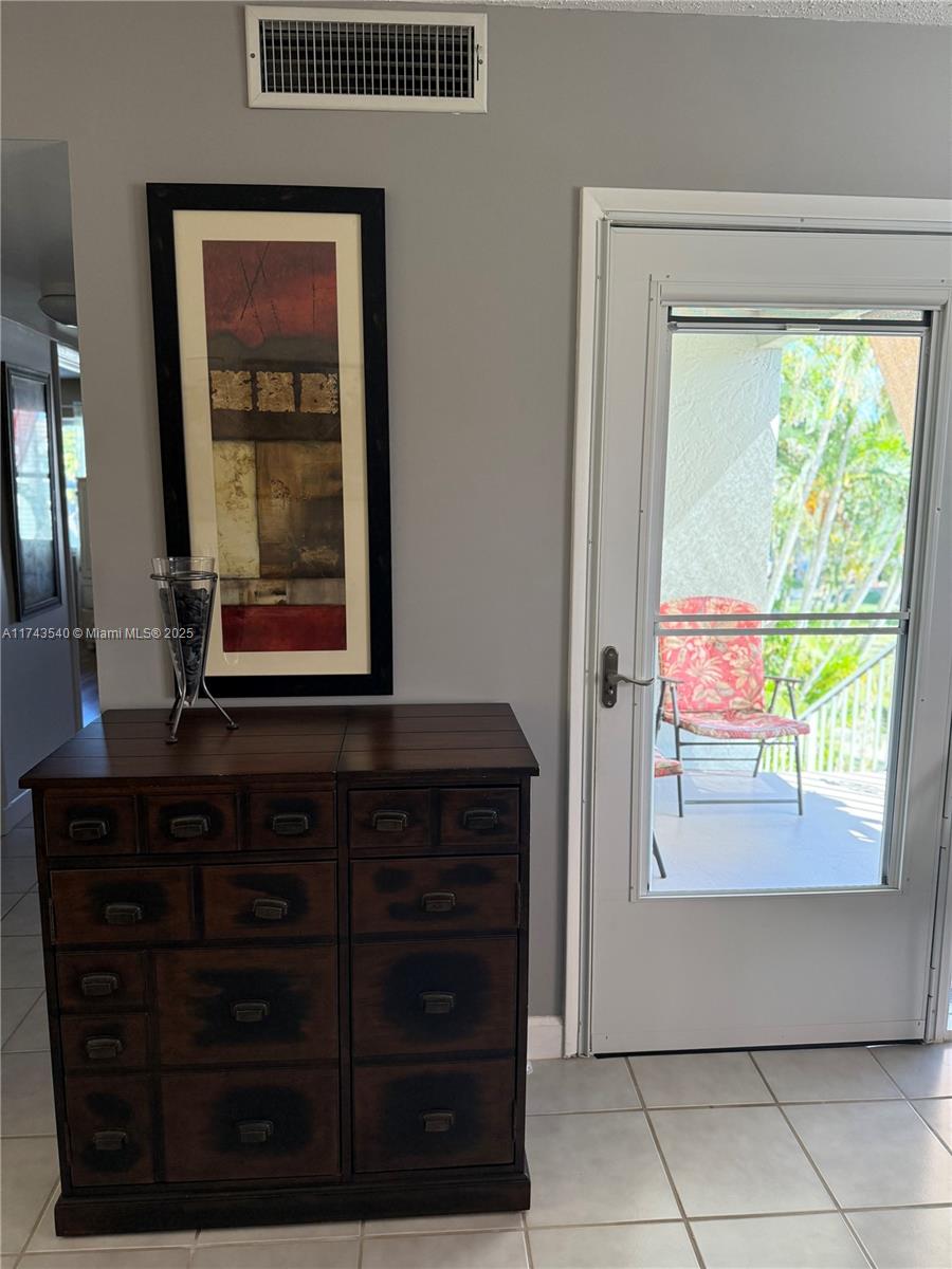 609 Waterside Drive, Unit 609 Hypoluxo, FL 33462 - Photo 27 of 33 a view of an entryway with a window