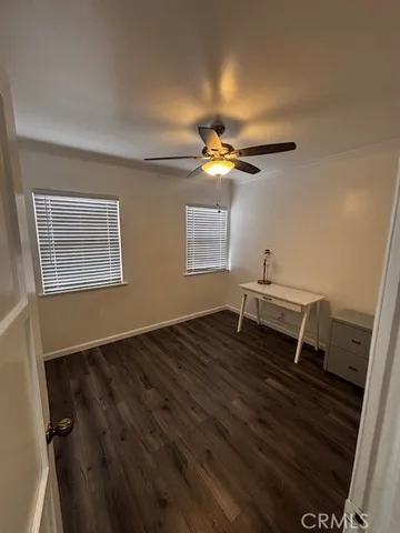 a view of workspace with wooden floor and window