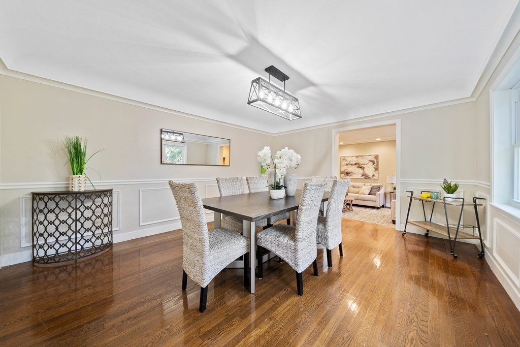 70 Burdean Road Newton, MA 02459 - Photo 13 of 38 a view of a dining room with furniture wooden floor and a chandelier