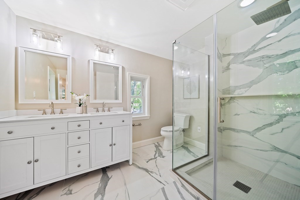 70 Burdean Road Newton, MA 02459 - Photo 25 of 38 a spacious bathroom with double vanity and a shower