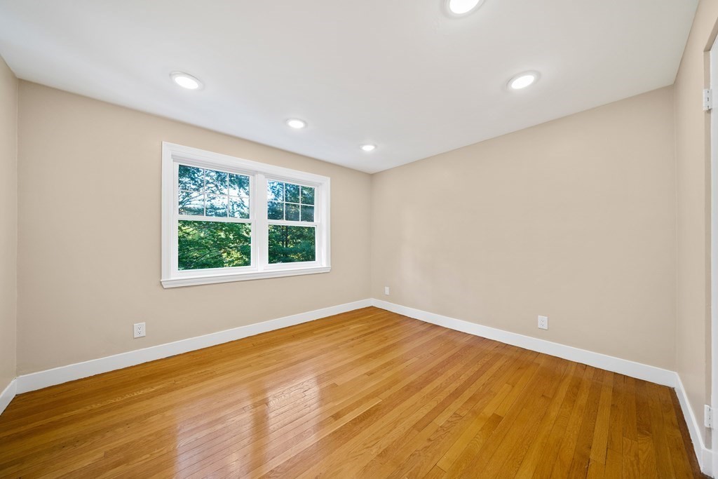 70 Burdean Road Newton, MA 02459 - Photo 26 of 38 a view of an empty room with wooden floor and a window