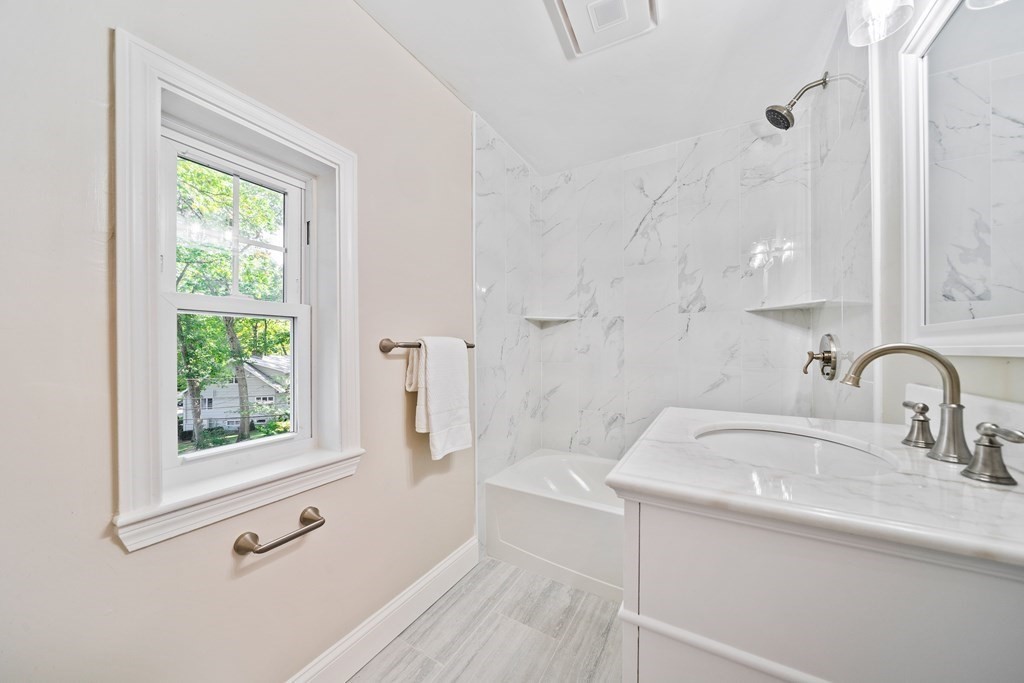 70 Burdean Road Newton, MA 02459 - Photo 28 of 38 a bathroom with a sink a toilet and a window