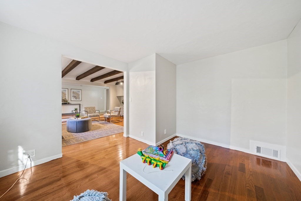 70 Burdean Road Newton, MA 02459 - Photo 5 of 38 a bedroom with furniture and a wooden floor