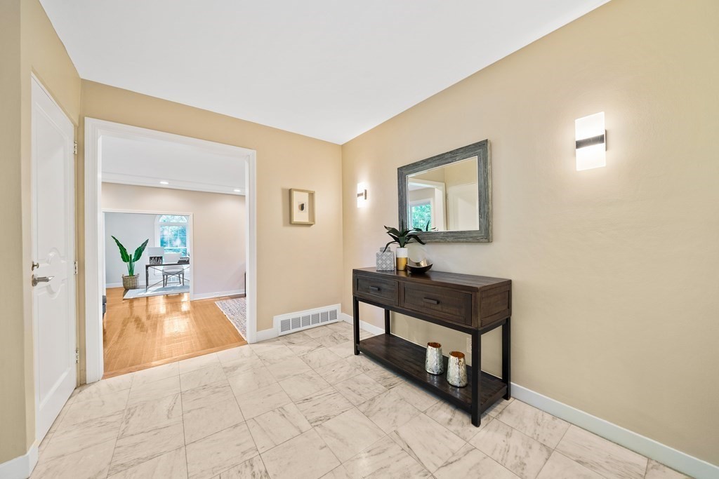 70 Burdean Road Newton, MA 02459 - Photo 7 of 38 a bedroom with a bed and a table in it