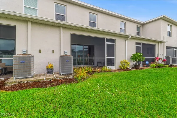 a view of an house with backyard space and garden