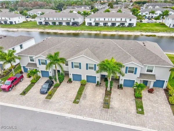 an aerial view of a house with a swimming pool and outdoor space