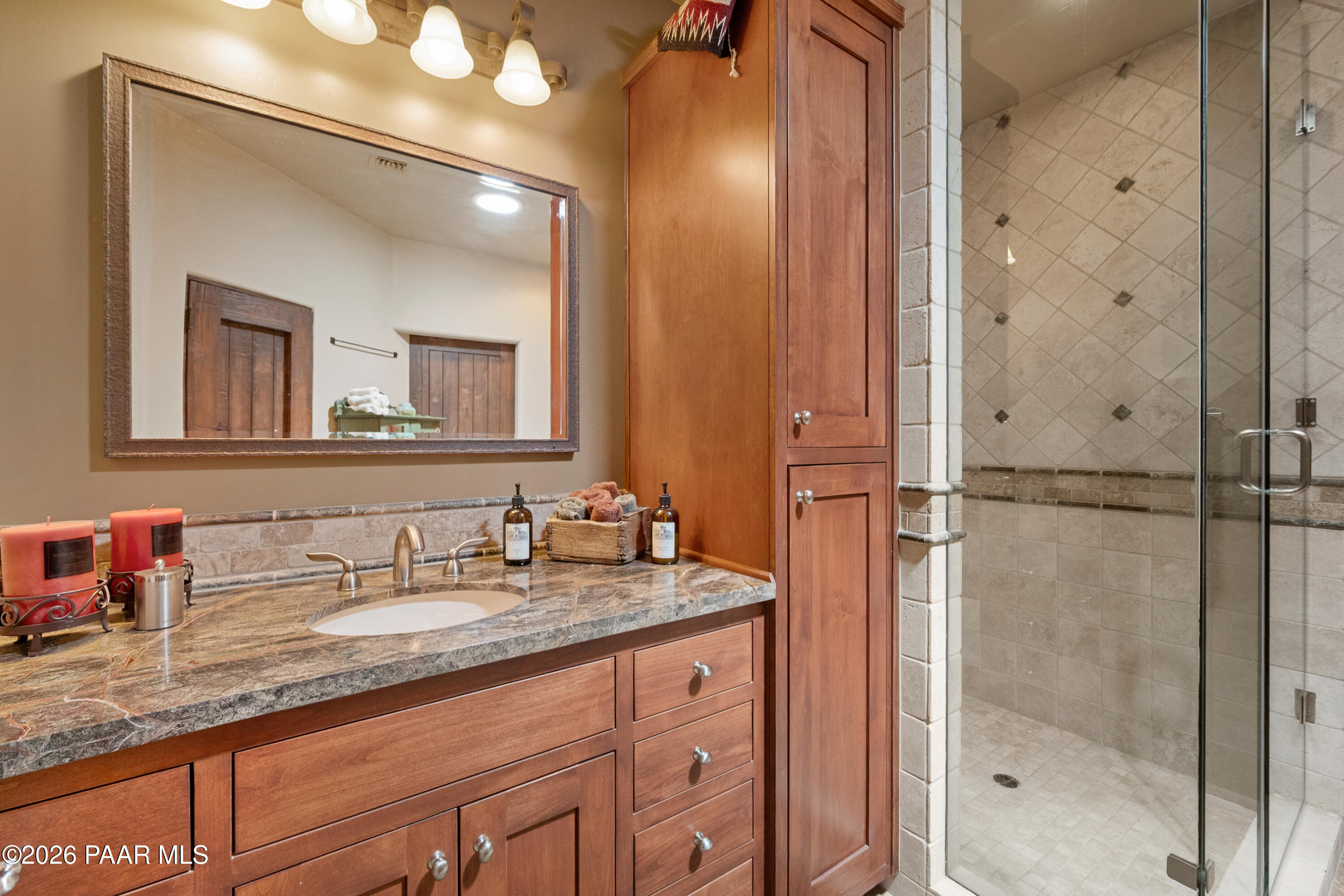 1515 High Valley Ranch Road Prescott, AZ 86303 - Photo 54 of 76 a bathroom with a granite countertop sink mirror and vanity