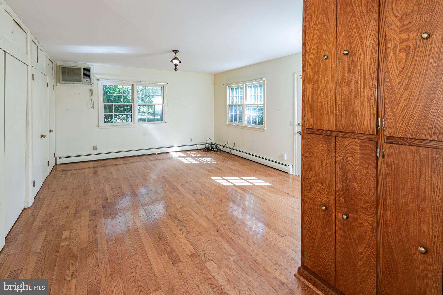 158 Carter Road Princeton, NJ 08540 - Photo 16 of 29 a view of an empty room with wooden floor and a window