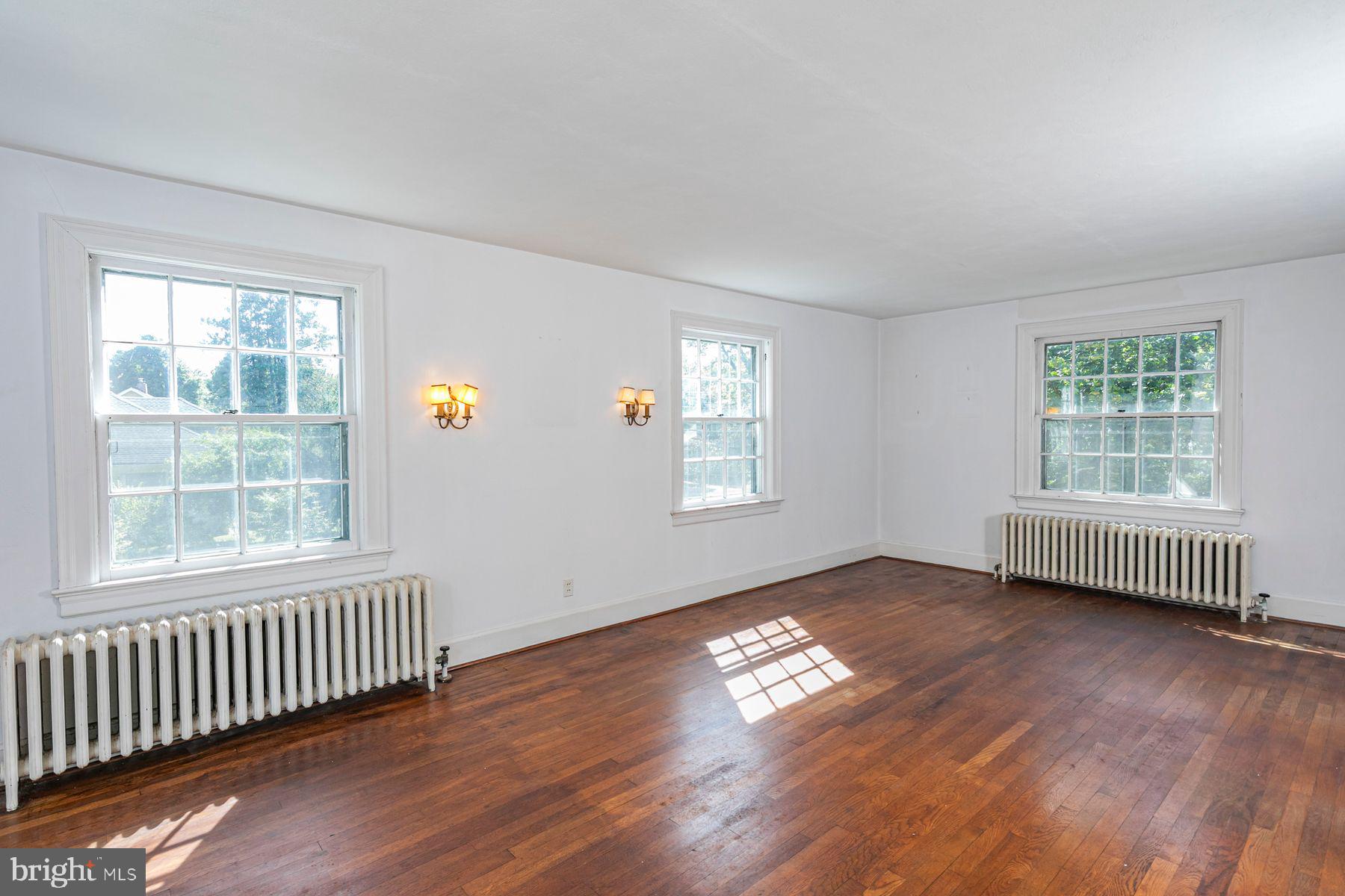 158 Carter Road Princeton, NJ 08540 - Photo 21 of 29 an empty room with wooden floor and windows