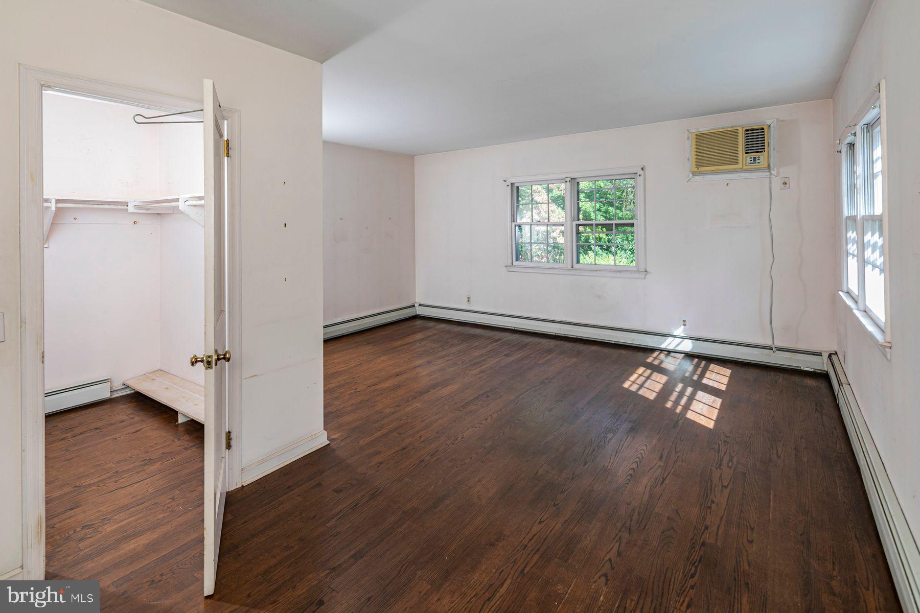158 Carter Road Princeton, NJ 08540 - Photo 24 of 29 an empty room with wooden floor closet and windows