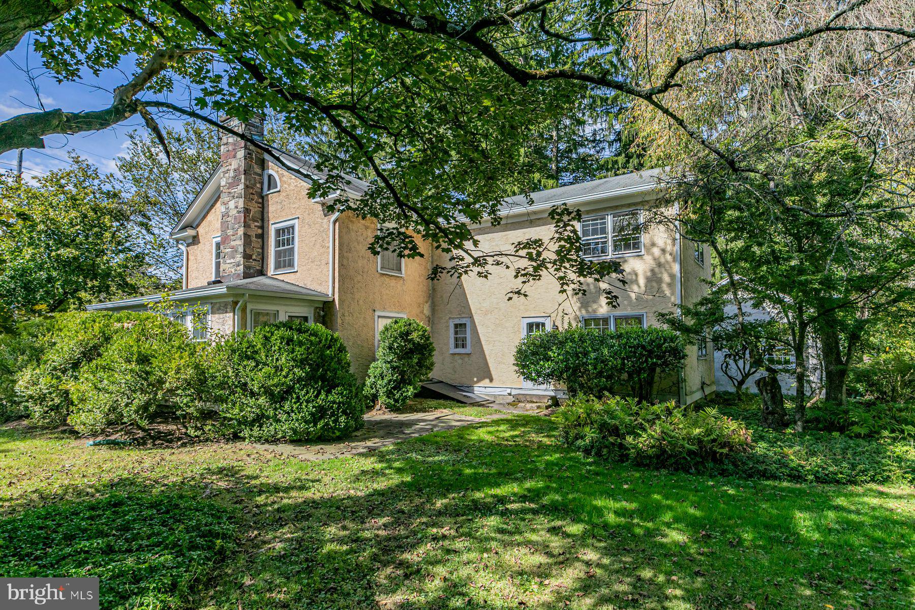 158 Carter Road Princeton, NJ 08540 - Photo 26 of 29 a front view of a house with a yard and glass windows