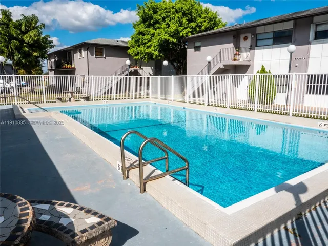 a view of swimming pool with a patio