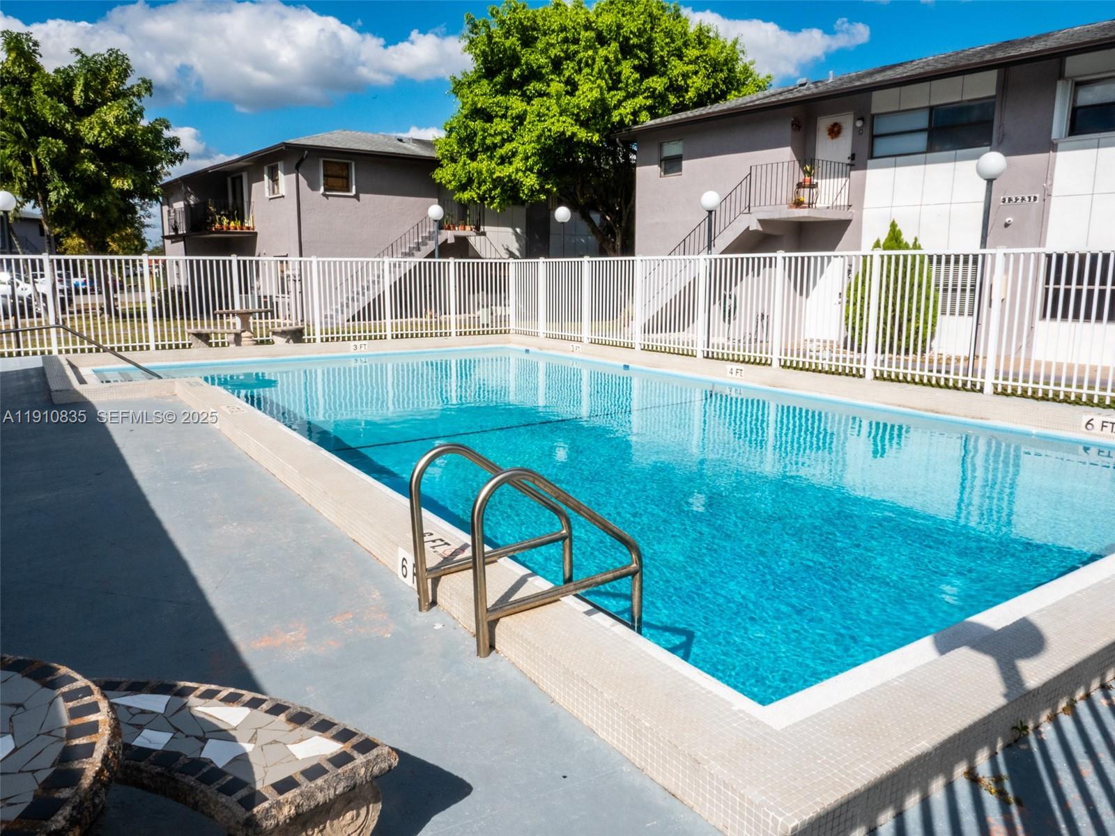 13241 Southwest 17th Lane, Unit 234 Miami, FL 33175 - Photo 13 of 16 a view of swimming pool with a patio