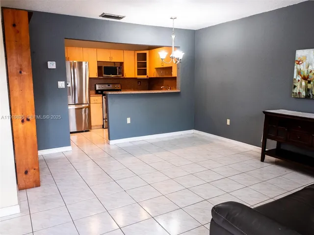 a bedroom with a bed and a television