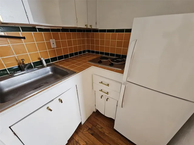 a bathroom with a sink mirror toilet and bathtub