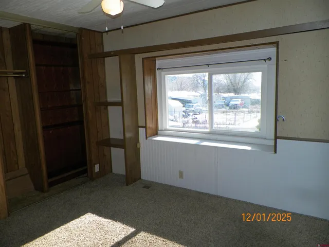 a view of a closet in kitchen