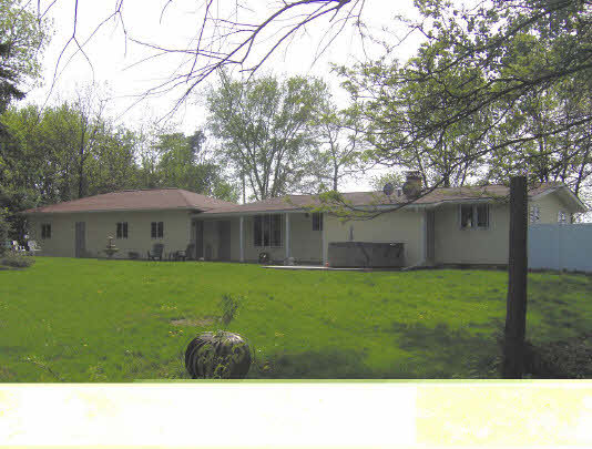 7711 South Thorpe Road Rochelle, IL 61068 - Photo 4 of 6 a black and white photo in a big yard