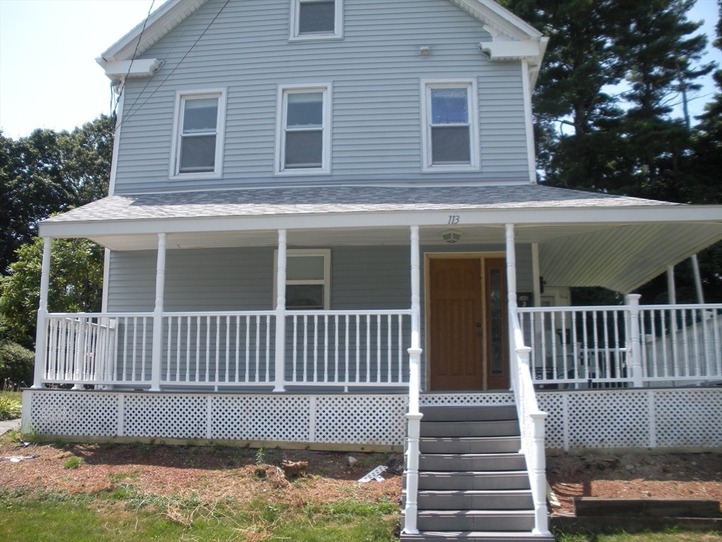 113 Rockland Street, Unit 2 Canton, MA 02021 - Photo 22 of 22 a view of a house with a small deck